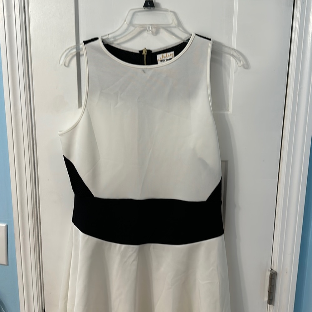 Ashley Graham off white with black waist band dress